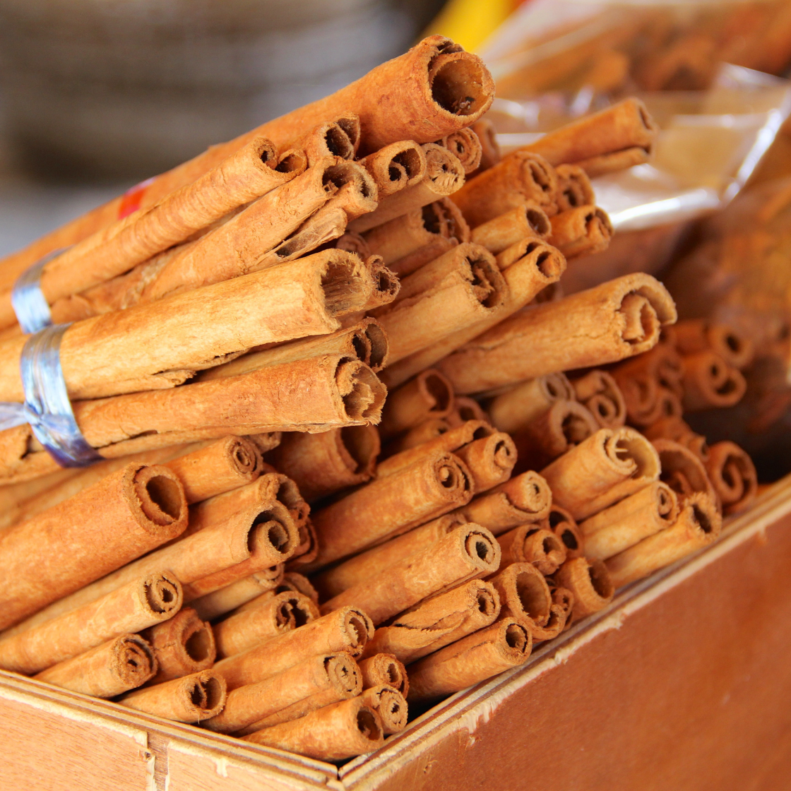 Bundles of cinnamon sticks tied with silver cord.