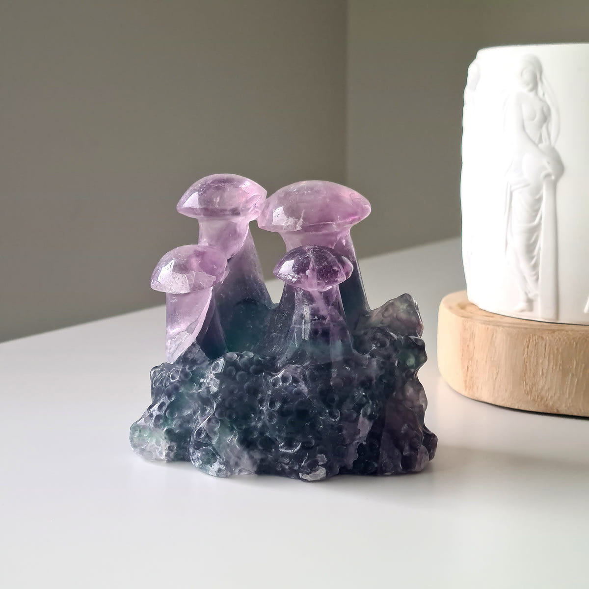 Fluorite Crystal Mushroom Family, 8.7 cm, with purple mushroom caps and a green-toned carved base.