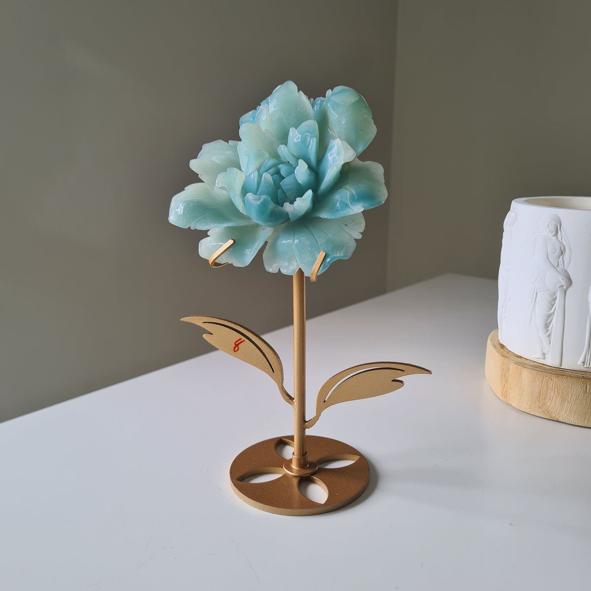 Caribbean Calcite Crystal Flower On Stand, 9 cm, with aqua petals on a gold-toned stem and leaf stand.