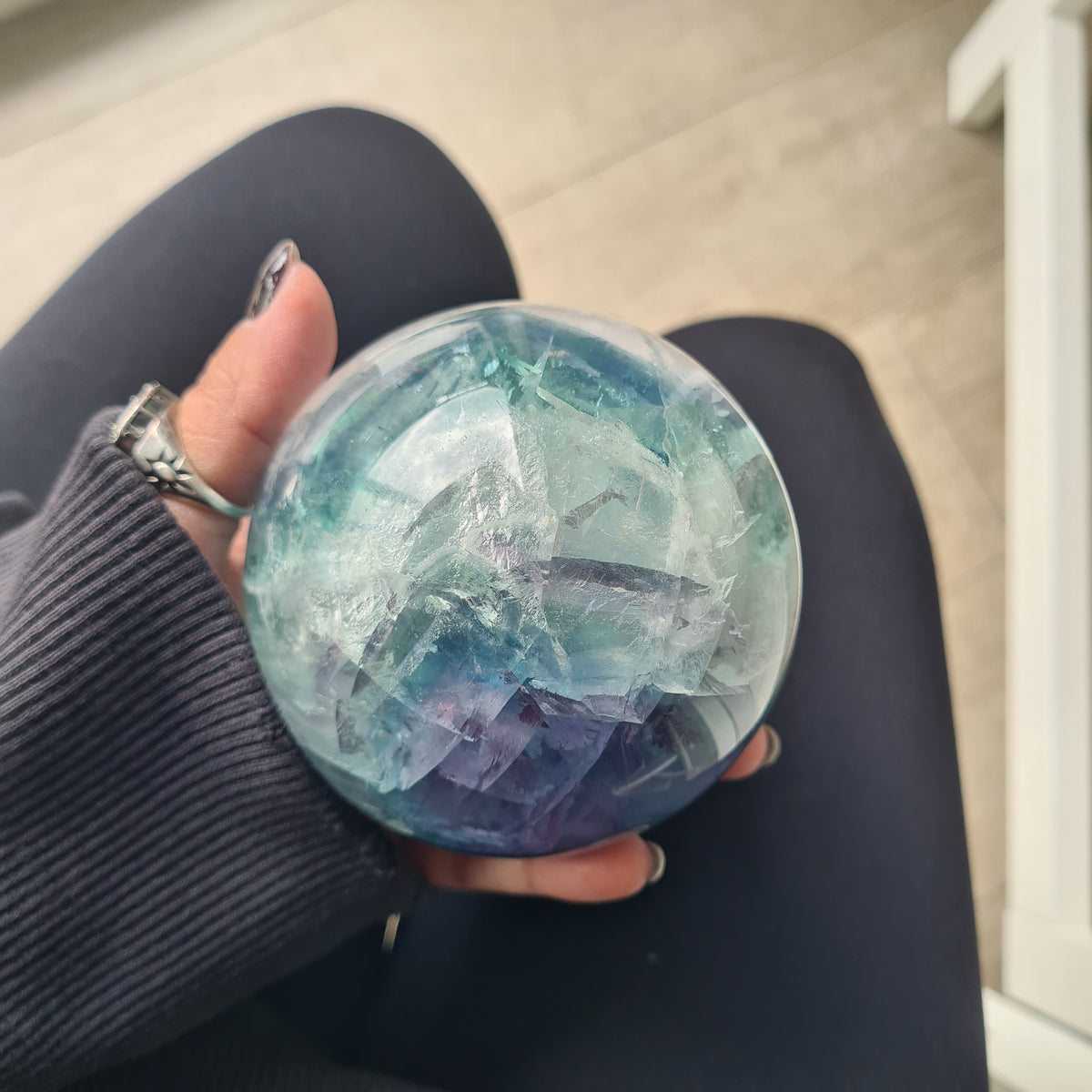 Rainbow Fluorite sphere, 8.5 cm, with green, blue and purple layers and natural internal formations.
