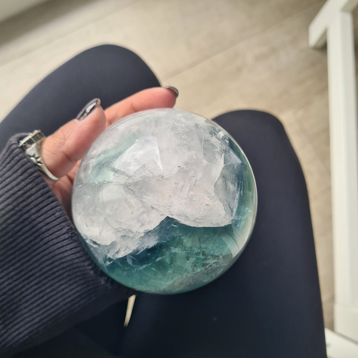 Rainbow Fluorite sphere, 8.5 cm, with green, blue and purple layers and natural internal formations.