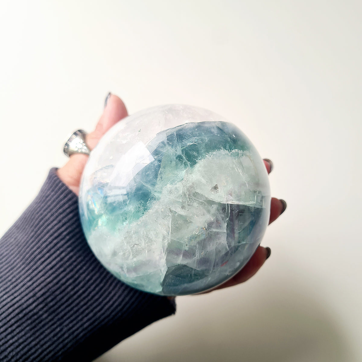 Rainbow Fluorite sphere, 8.5 cm, with green, blue and purple layers and natural internal formations.