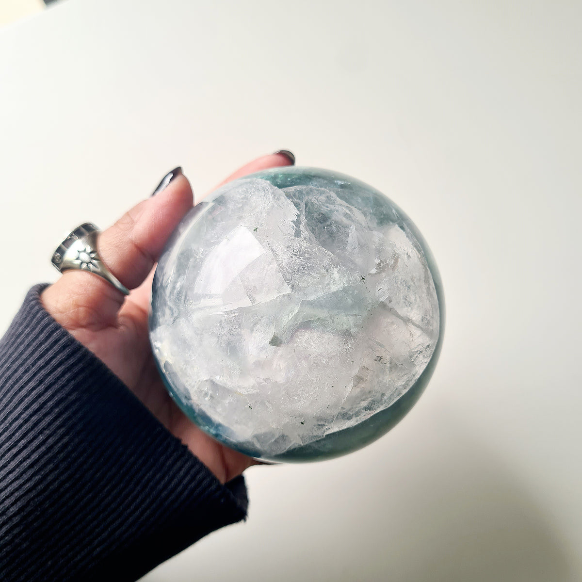 Rainbow Fluorite sphere, 8.5 cm, with green, blue and purple layers and natural internal formations.
