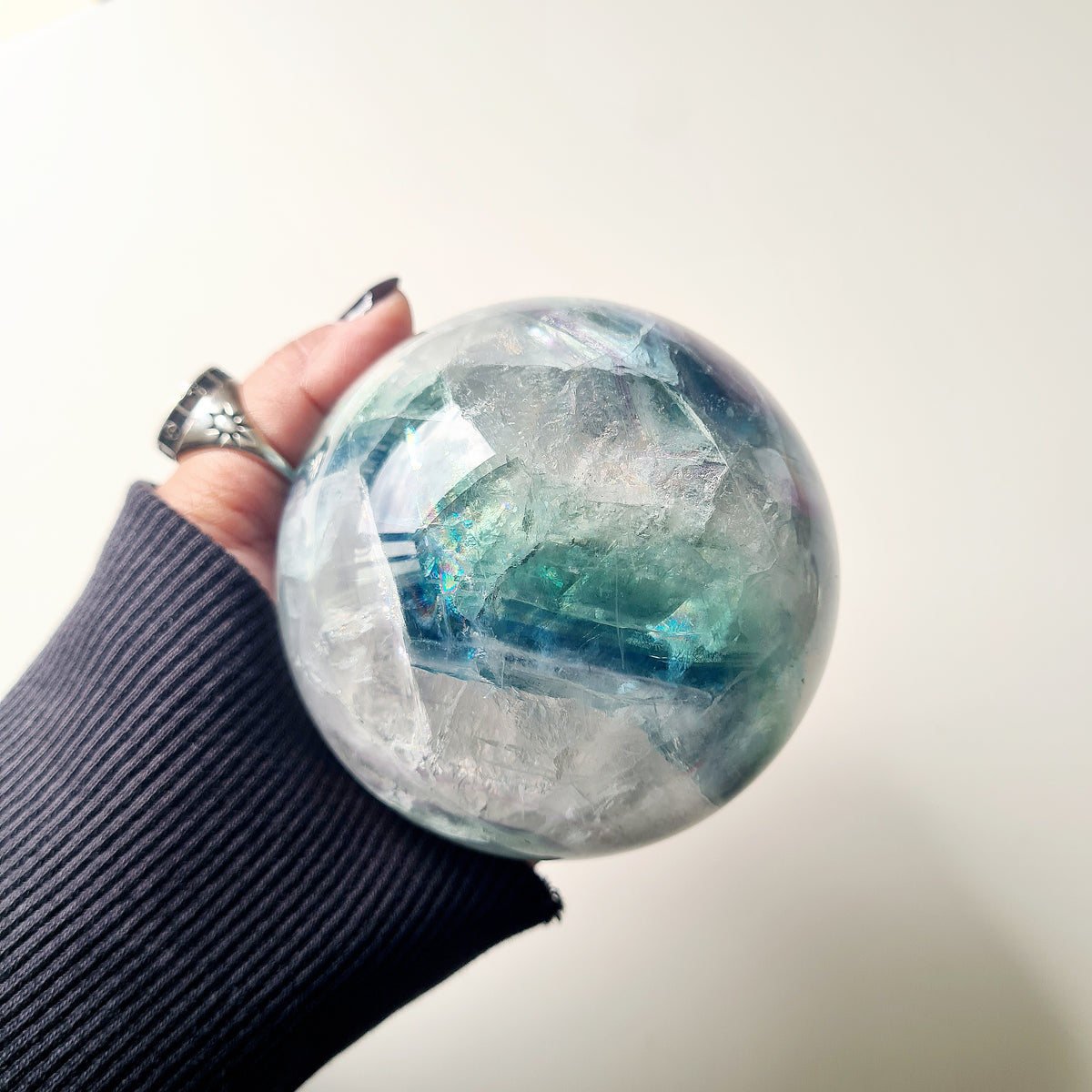 Rainbow Fluorite sphere, 8.5 cm, with green, blue and purple layers and natural internal formations.