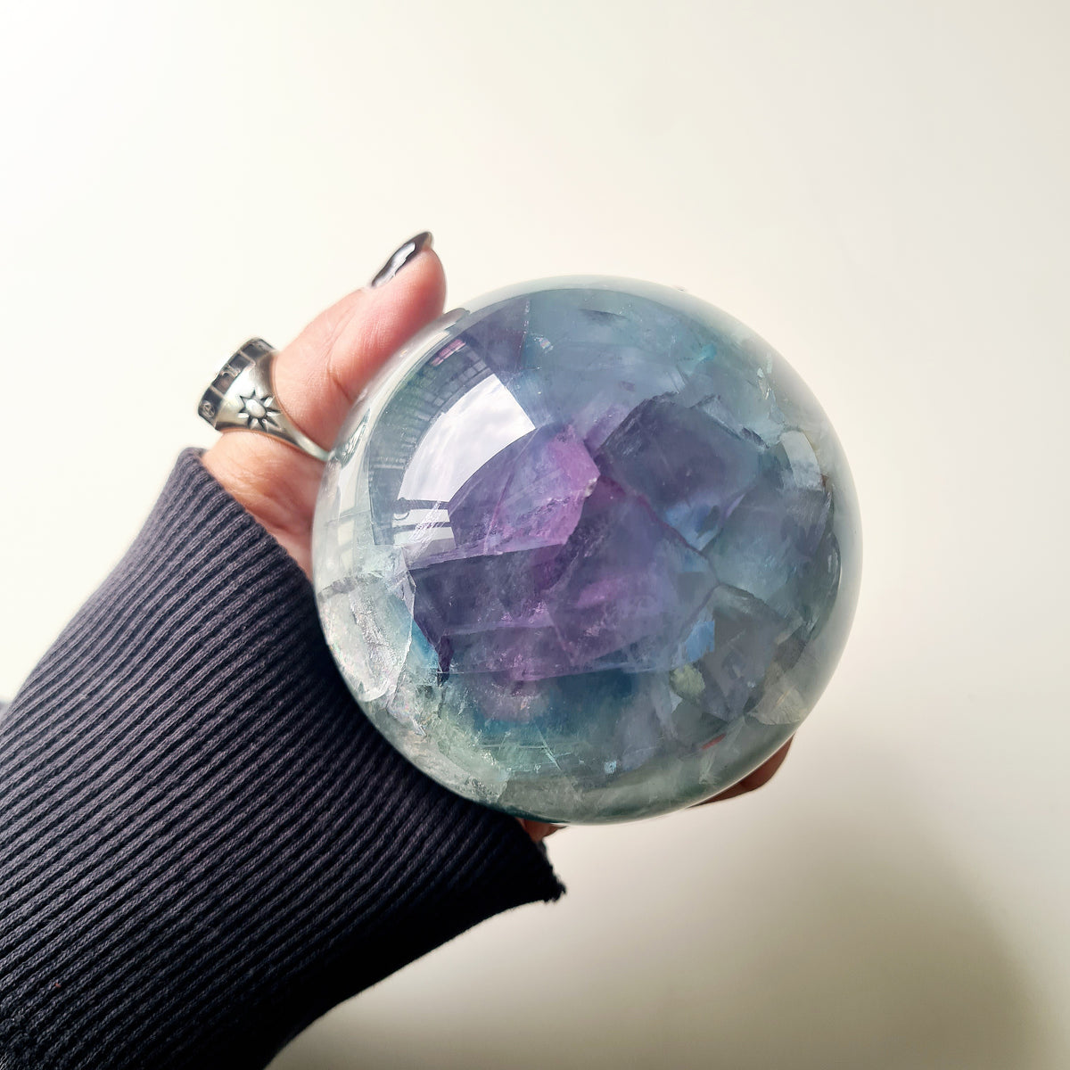 Rainbow Fluorite sphere, 8.5 cm, with green, blue and purple layers and natural internal formations.