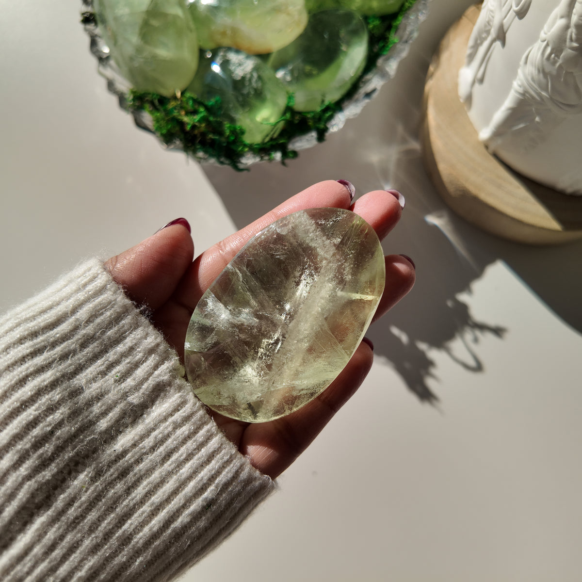 Alternate view of pale-green Fluorite pocket stone A, showing its natural internal patterns.
