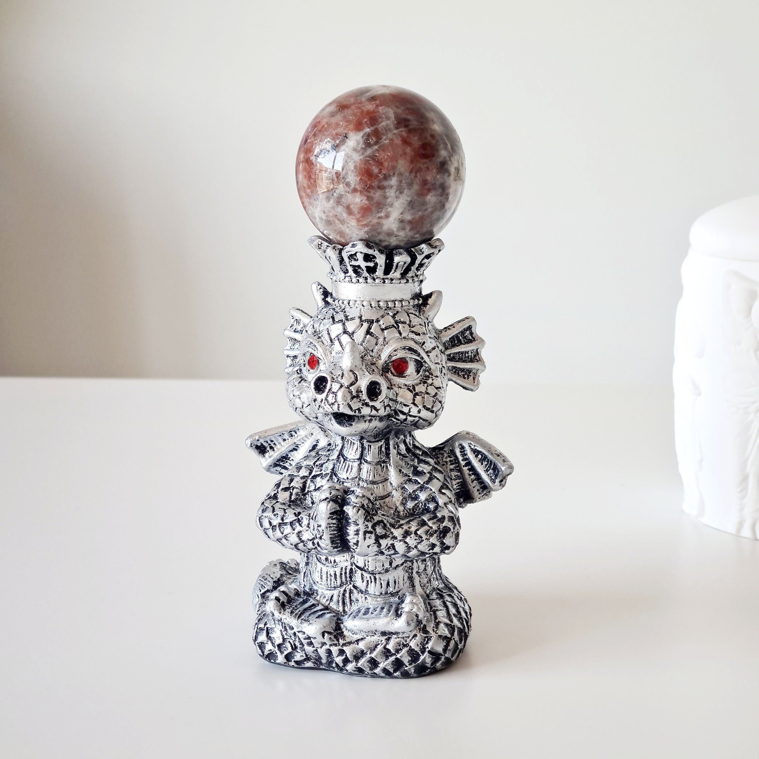 Sunstone peach Moonstone sphere on dragon stand