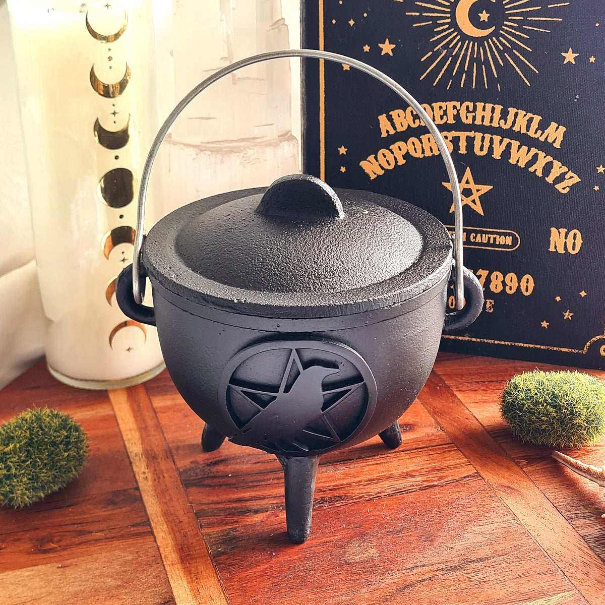 Black cast iron Raven ritual cauldron with raven centred inside a pentagram design.