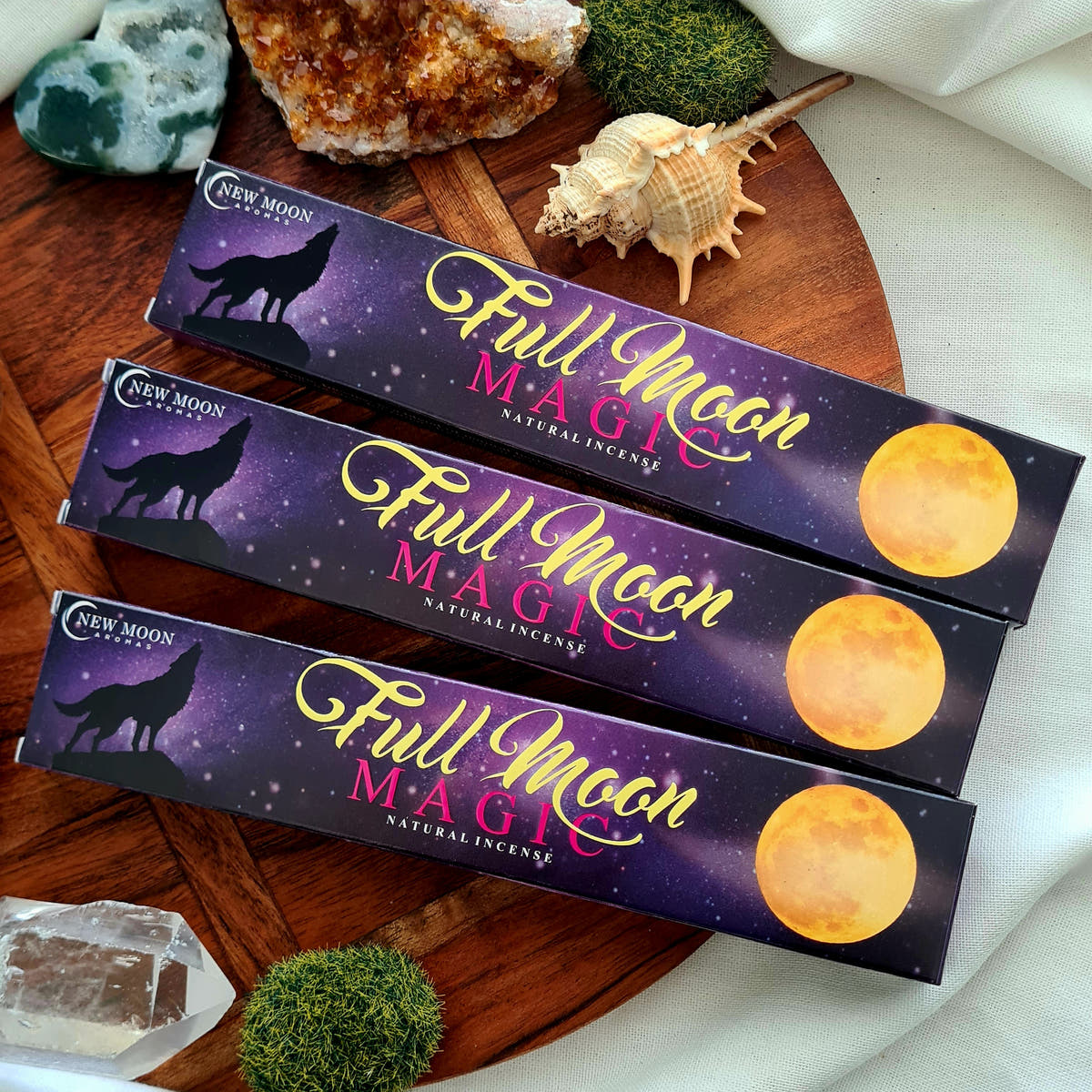 Three blue and purple Full Moon incense boxes.