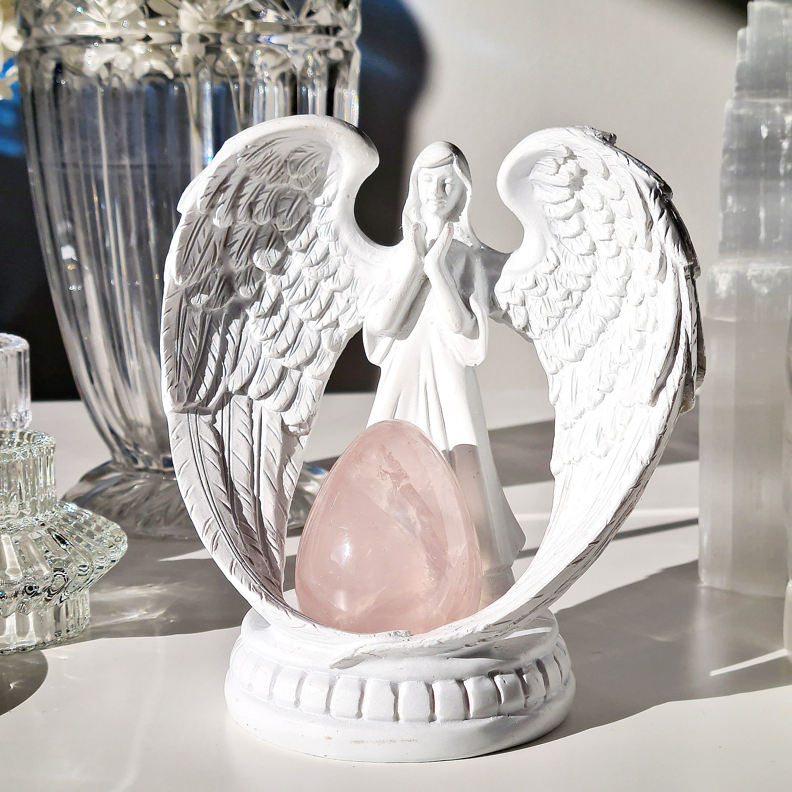 Icy rose quartz on guardian angel stand