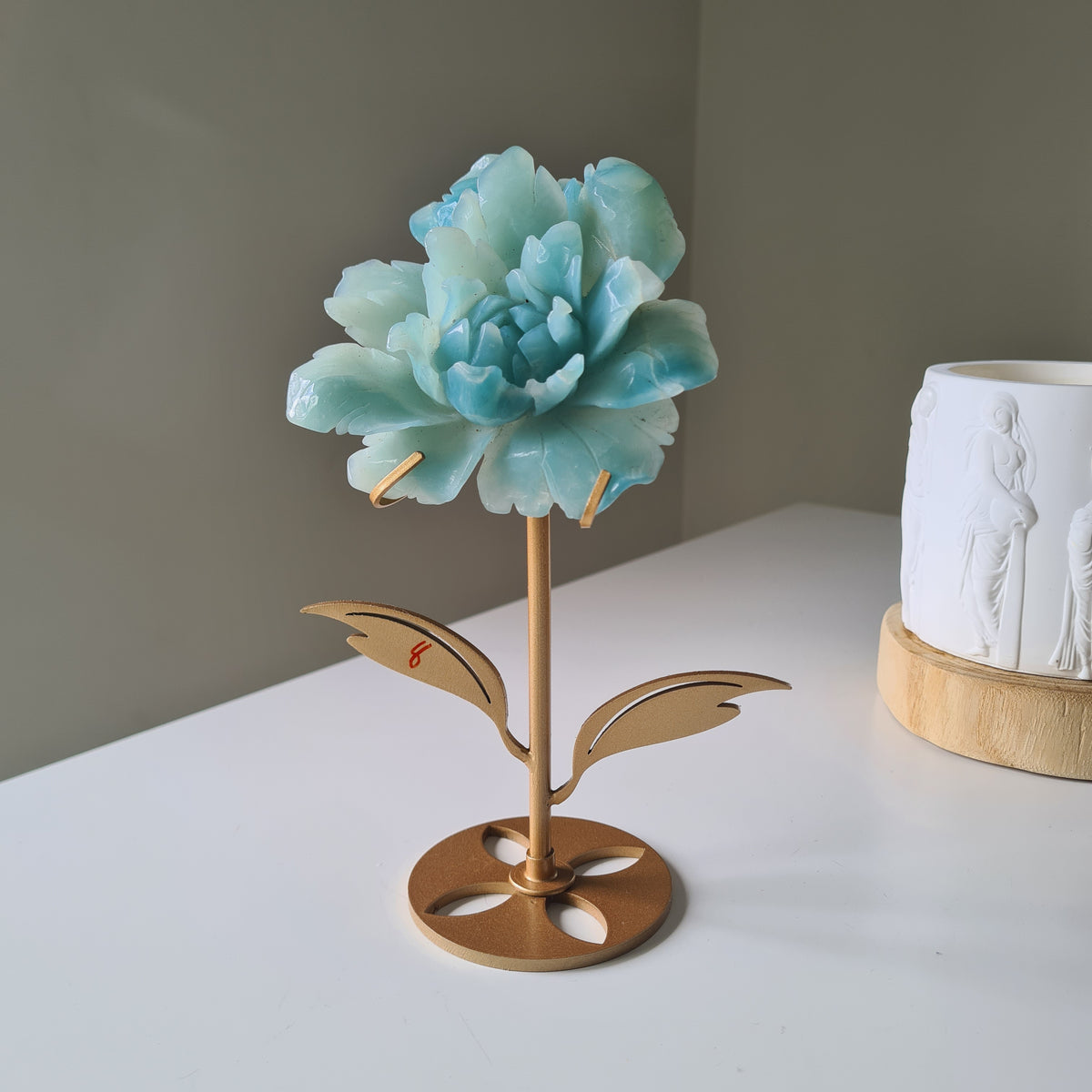 Caribbean Calcite Crystal Flower On Stand, 9 cm, with aqua petals on a gold-toned stem and leaf stand.