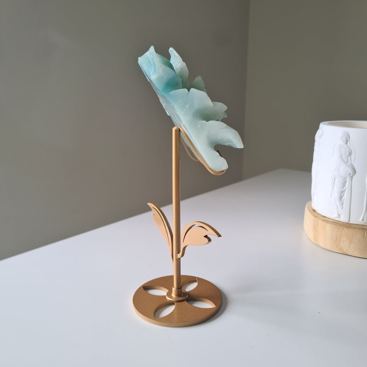 Caribbean Calcite Crystal Flower On Stand, 9 cm, with aqua petals on a gold-toned stem and leaf stand.