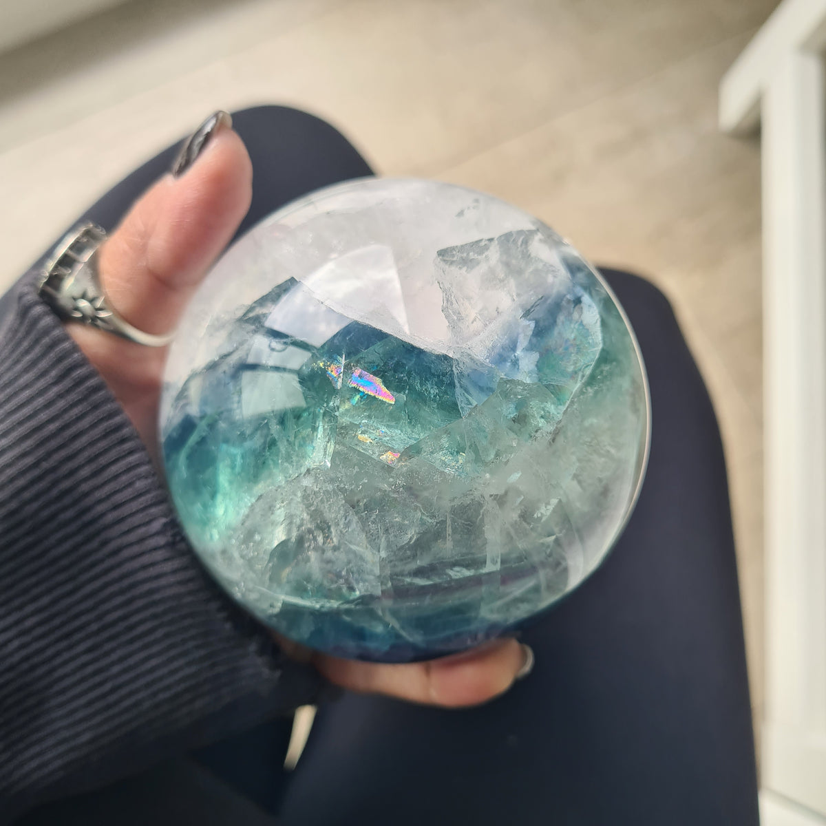 Rainbow Fluorite sphere, 8.5 cm, with green, blue and purple layers and natural internal formations.