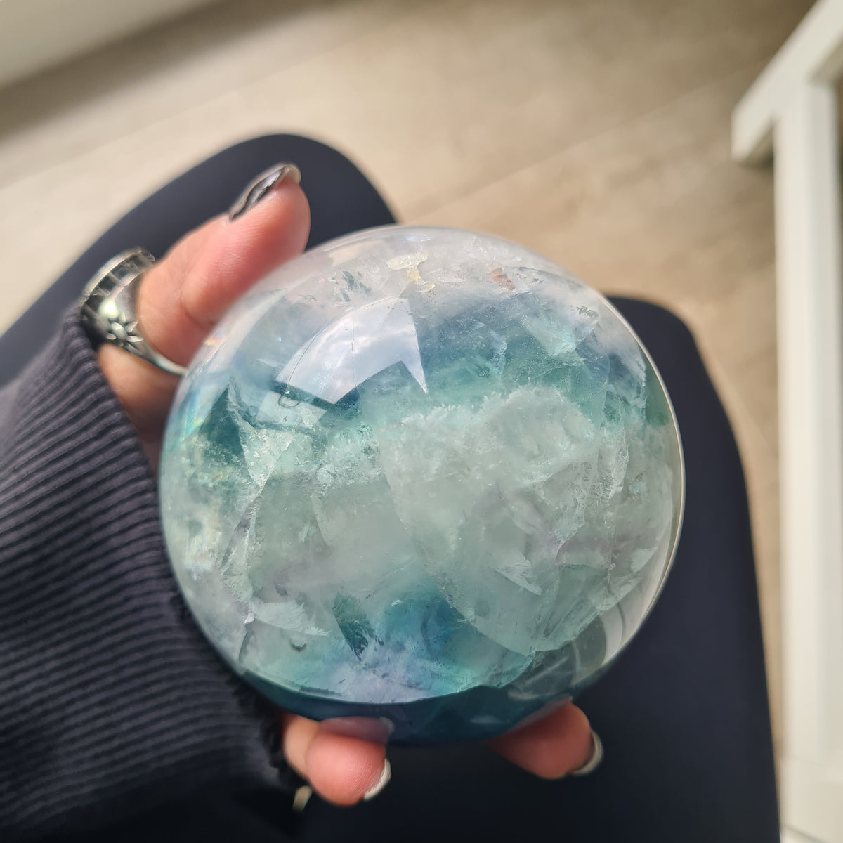 Rainbow Fluorite sphere, 8.5 cm, with green, blue and purple layers and natural internal formations.