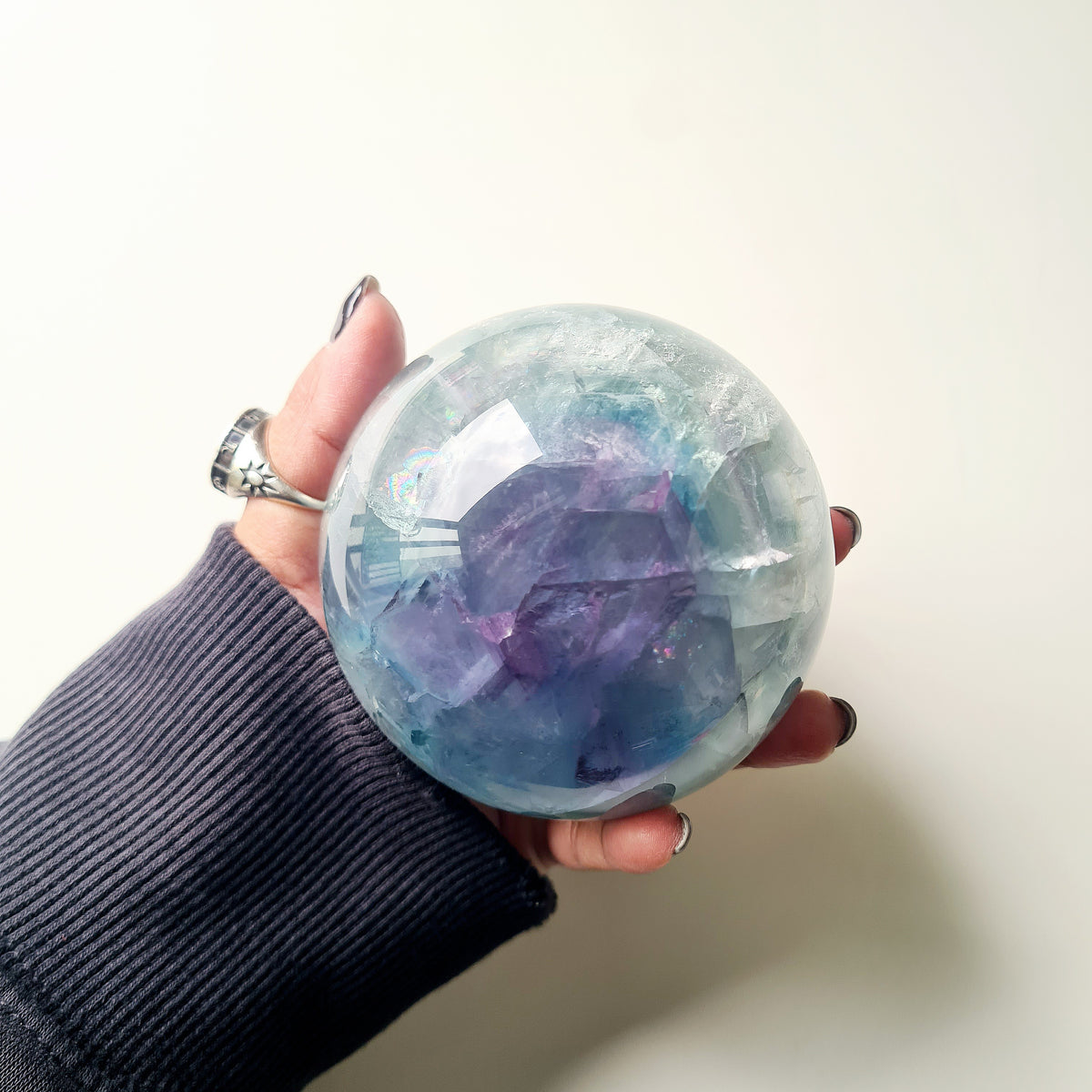 Rainbow Fluorite sphere, 8.5 cm, with green, blue and purple layers and natural internal formations.