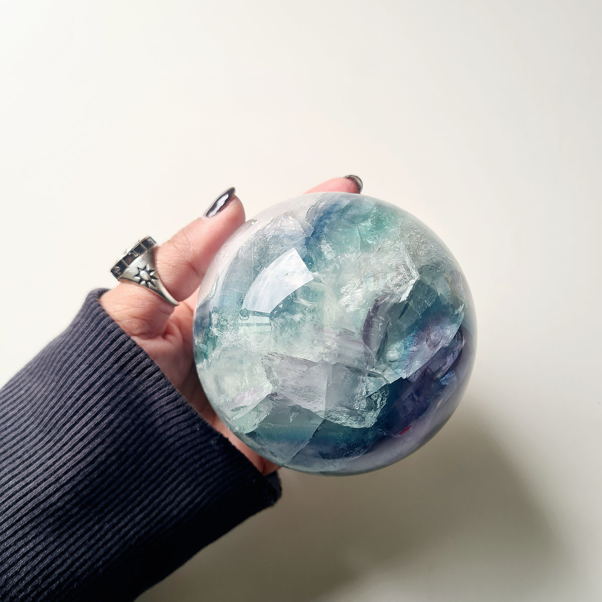 Rainbow Fluorite sphere, 8.5 cm, with green, blue and purple layers and natural internal formations.