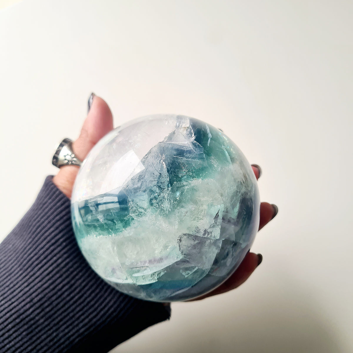 Rainbow Fluorite sphere, 8.5 cm, with green, blue and purple layers and natural internal formations.