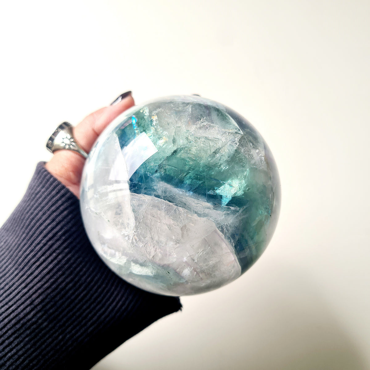 Rainbow Fluorite sphere, 8.5 cm, with green, blue and purple layers and natural internal formations.