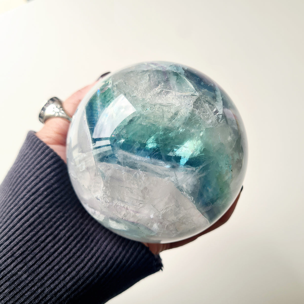 Rainbow Fluorite sphere, 8.5 cm, with green, blue and purple layers and natural internal formations.