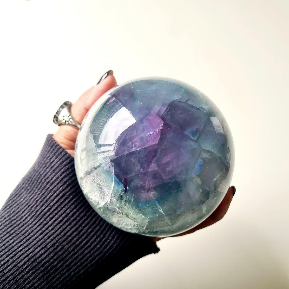 Rainbow Fluorite sphere, 8.5 cm, with green, blue and purple layers and natural internal formations.