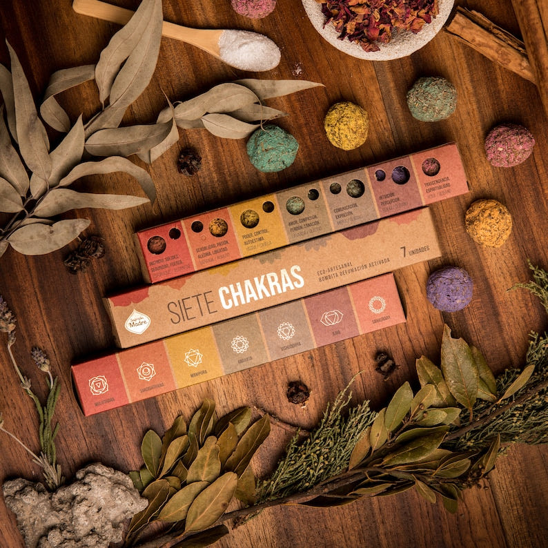 Boxes of 7 Chakra smudge bombs with coloured incense pieces and dried botanicals.