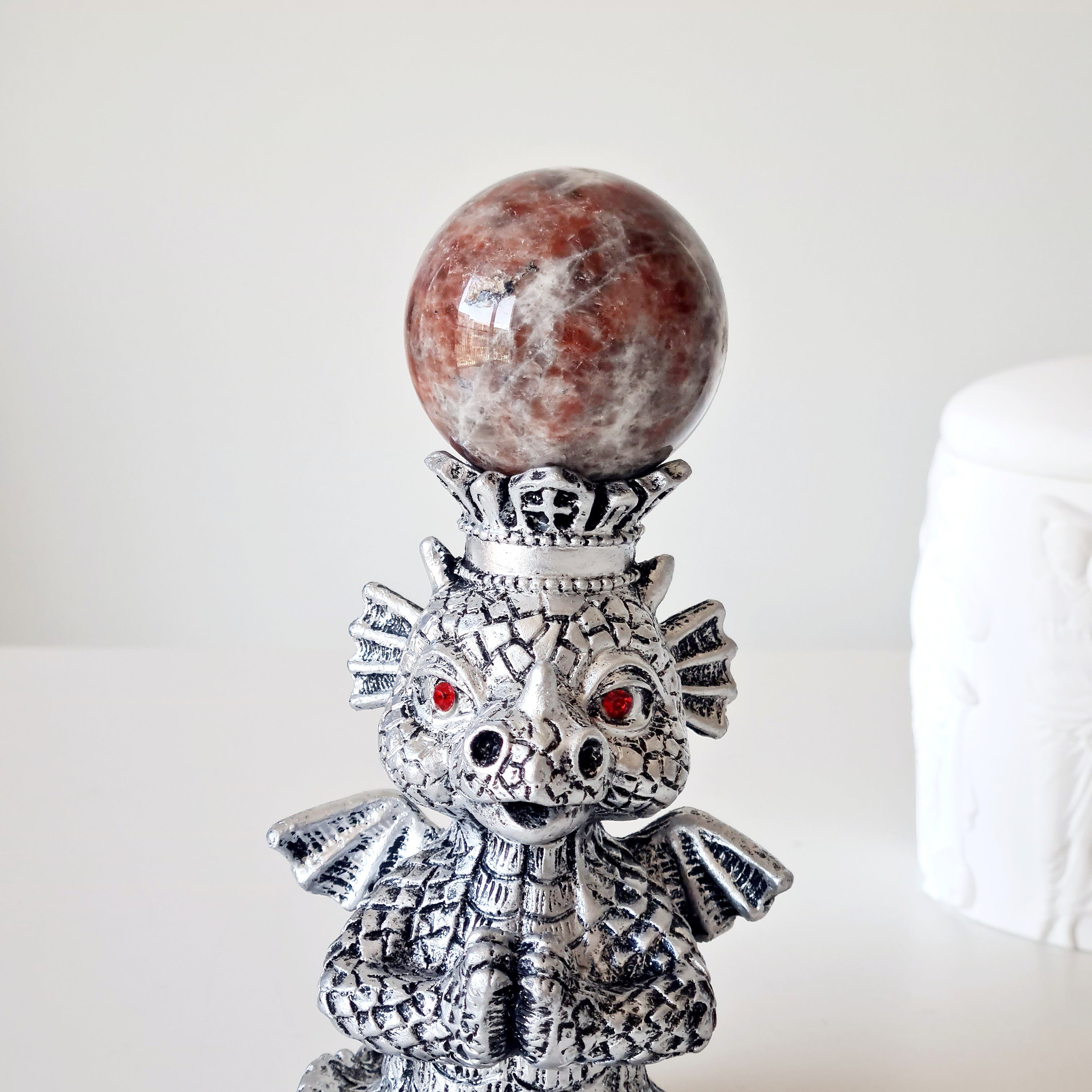 Sunstone peach Moonstone sphere on dragon stand