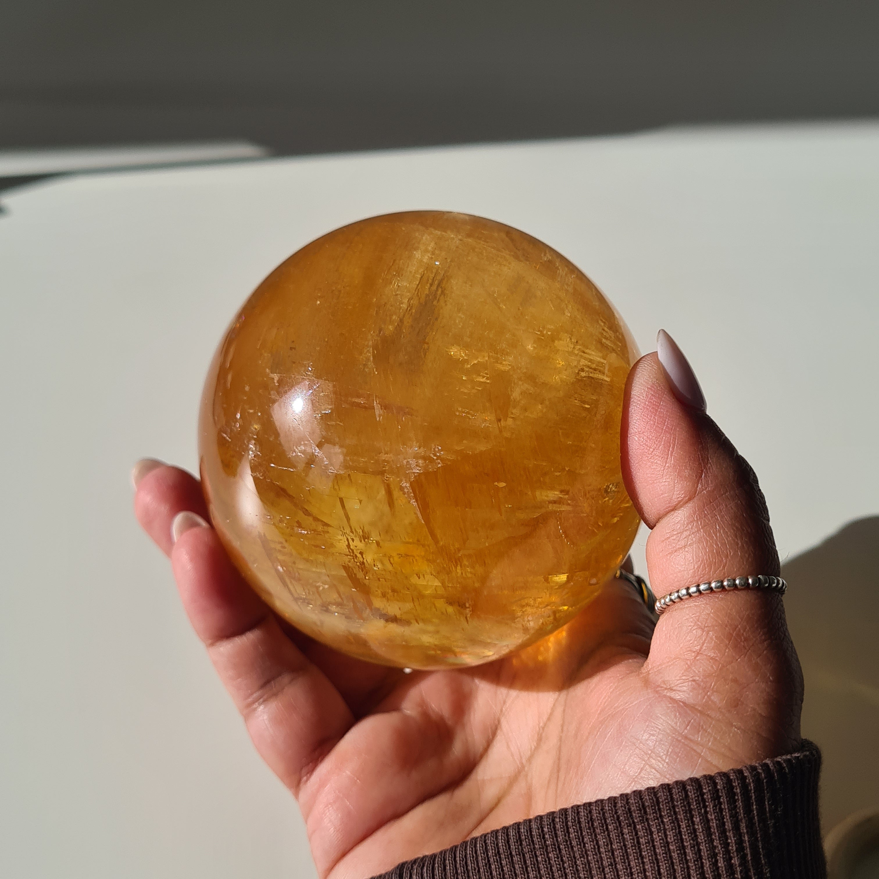 Ethereal Honey Calcite Sphere | B | 690 g | 7.7 cm